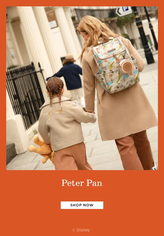 peter pan. shop now. by disney. mom wearing the method backpack in off to never land while holding toddler girl's hand