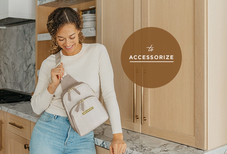 to accessorize mom wearing the criss-cross sling in grey matte cable stitch