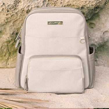 sync backpack in sand cable stitch