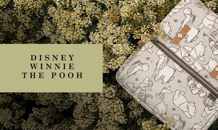 disney winnie the pooh. featuring the mini meta backpack in playful pooh