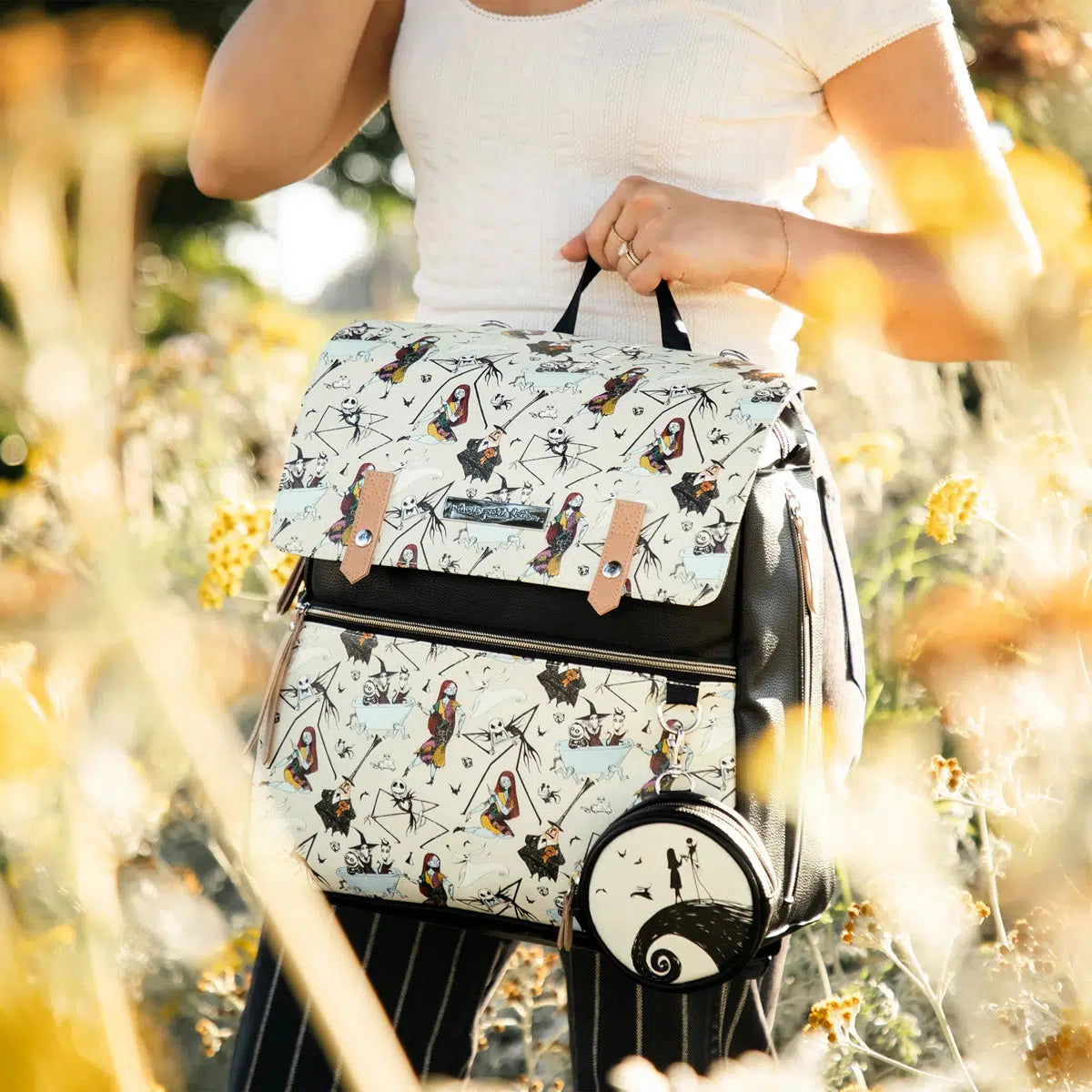 mom holding meta backpack in halloween town