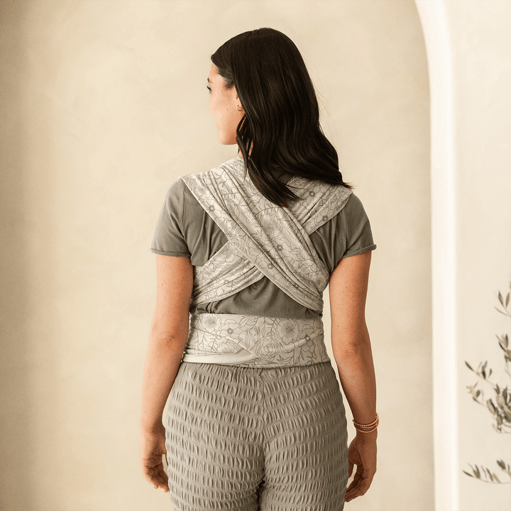 mom wearing baby in Petunia Pickle Bottom x MOBY Classic Wrap in Seaside Poppies