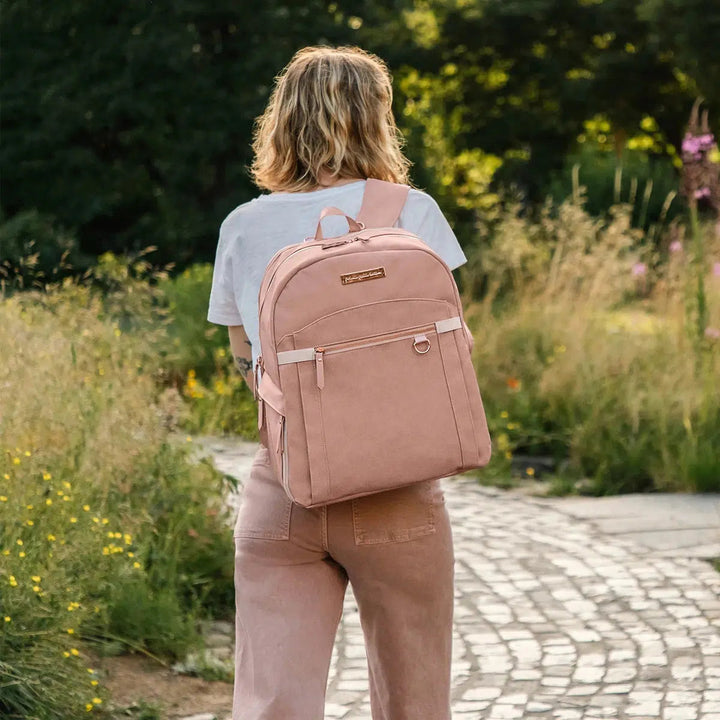 mom wearing provisions backpack in toffee rose
