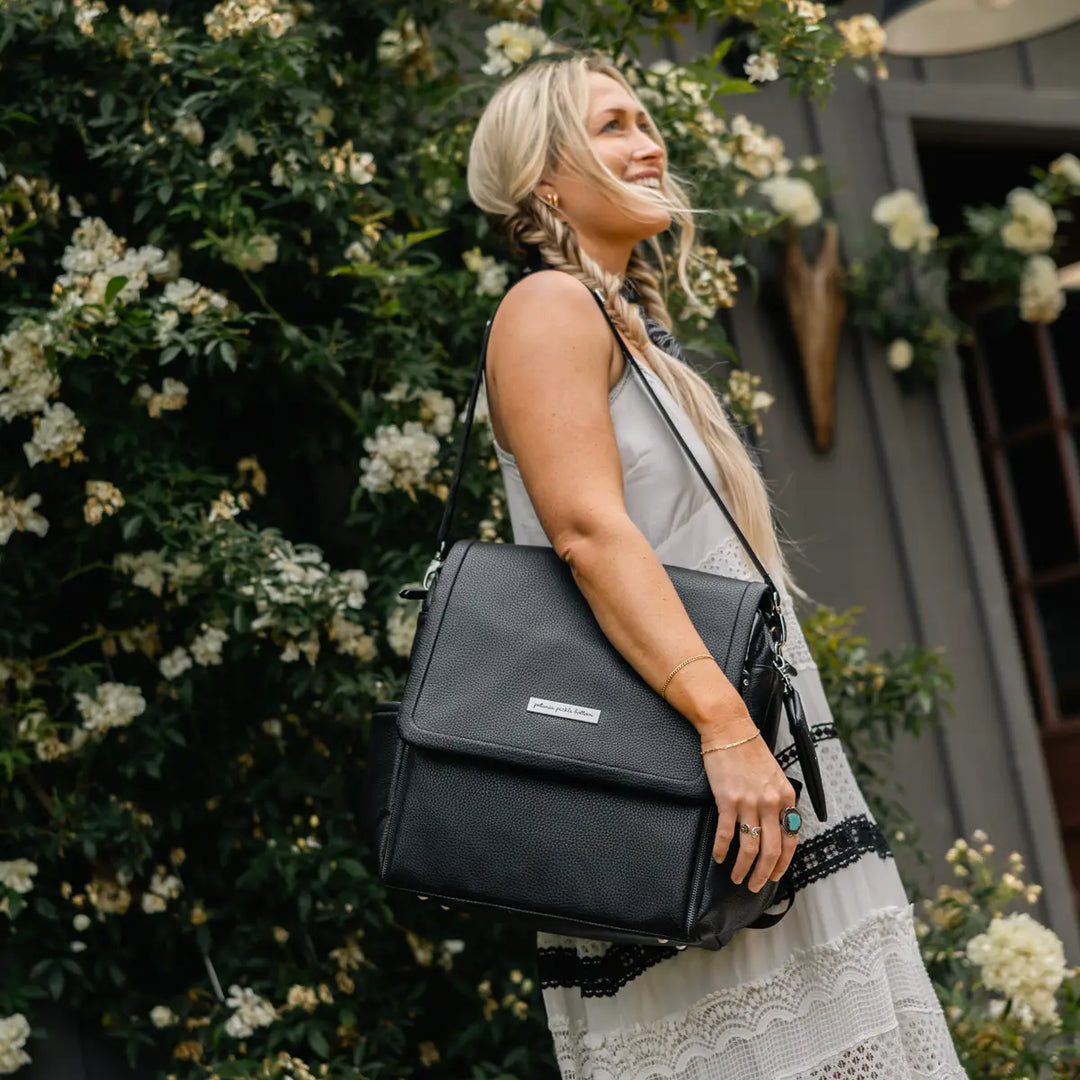 mom wearing the boxy backpack in ebony