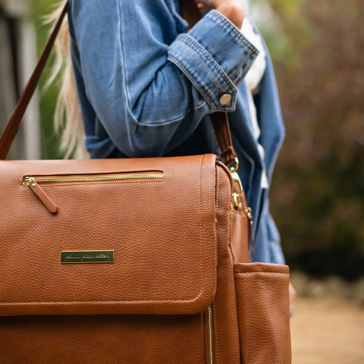 mom wearing the boxy backpack deluxe in cedar