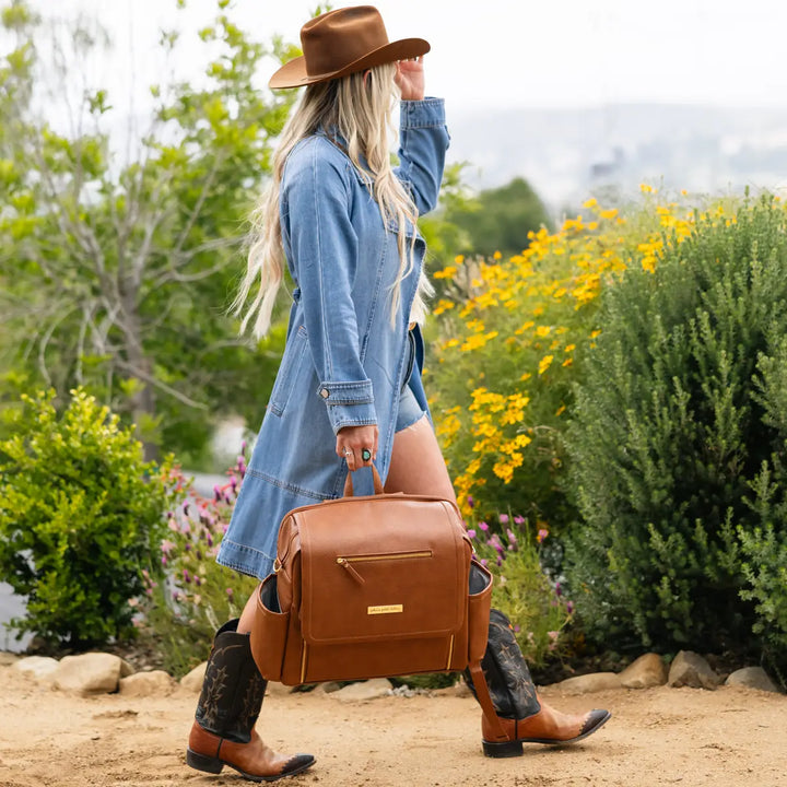 mom wearing the boxy backpack deluxe in cedar