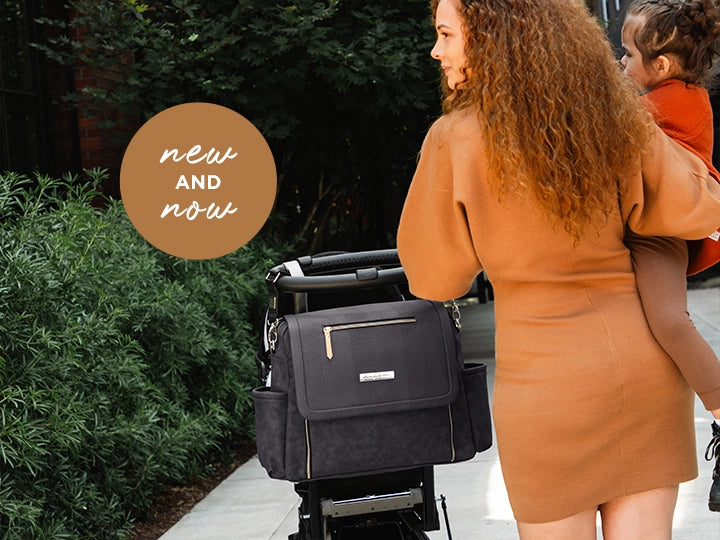 Boxy Backpack Deluxe converts to stroller-ready diaper bag shown here with mom & toddler