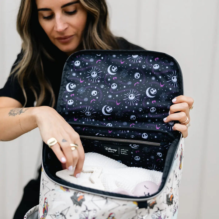 mom putting in props inside the Method Backpack in Disney's Halloween Town