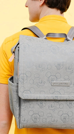 dad wearing the boxy backpack in love mickey mouse