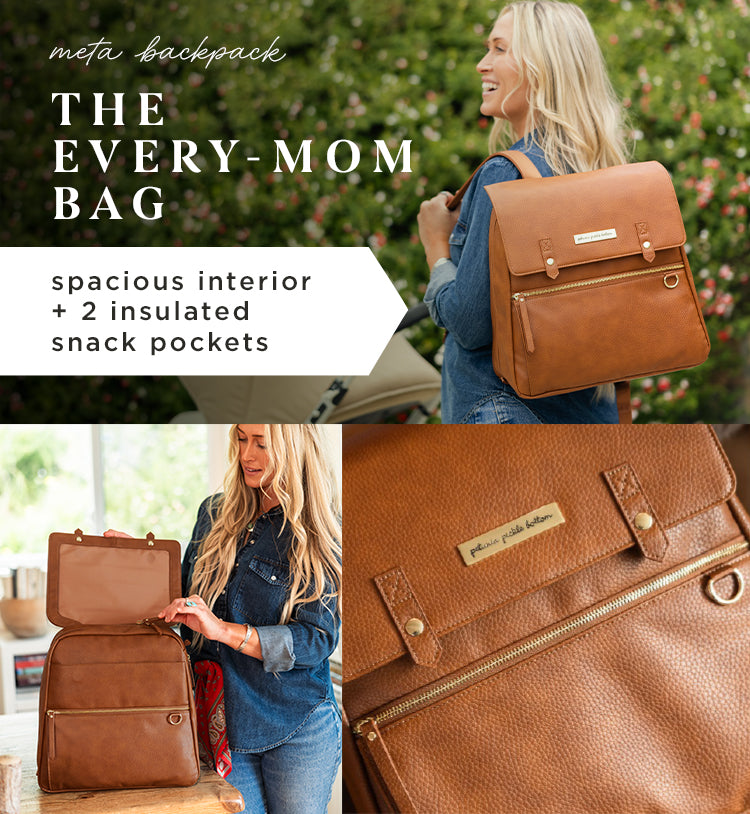 meta backpack. the every-mom bag. spacious interior + 2 insulated snack pockets. mom wearing the meta backpack in cedar