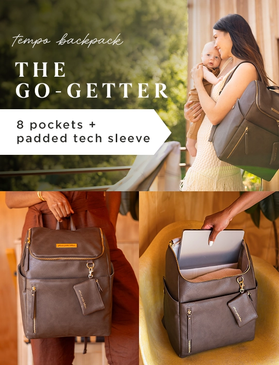 tempo backpack. the go-getter. 8 pockets + padded tech sleeve. mom holding baby while wearing the tempo backpack in saddle.