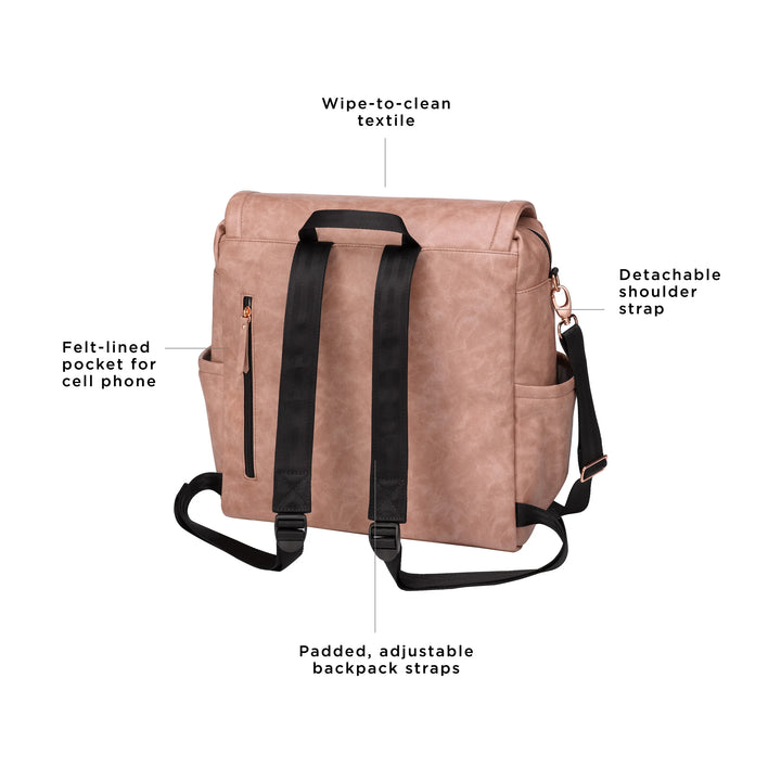 boxy backpack in dusty rose. wipe-to-clean textile. adjustable long strap for crossbody or shoulder carry. felt-lined pocket for cell phone. padded, adjustable backpack straps