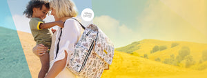 mom wearing petunia disney and pixar playday boxy backpack while holding baby