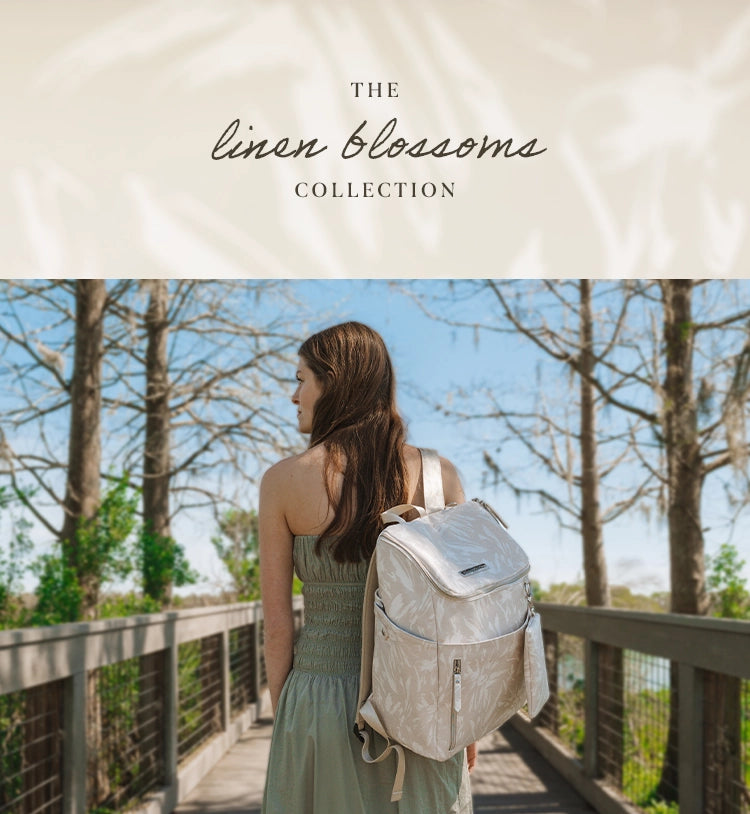 the linen blossom collection. mom wearing tempo backpack in linen blossom