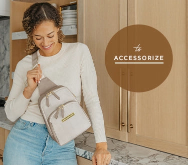 to accessorize mom wearing the criss-cross sling in grey matte cable stitch