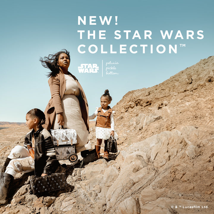 New the star wars collection. star wars by petunia pickle bottom. mom standing with kids while holding they are all holding star wars backpacks