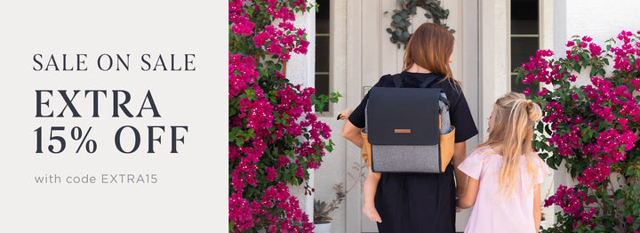 sale on sale. extra 15% off with code EXTRA15. mom wearing the boxy backpack in graphite camel