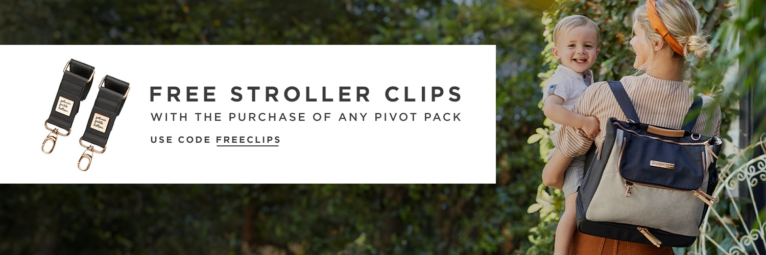 free stroller clips with the purchase of any pivot pack. use code FREECLIPS at checkout. mom holding baby while wearing the pivot pack in sand black
