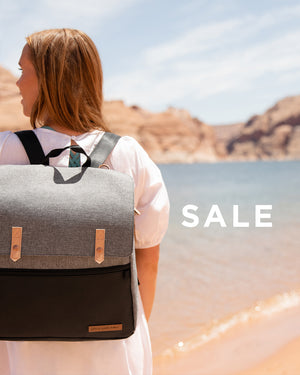 Sale. Mom holding the Meta backpack