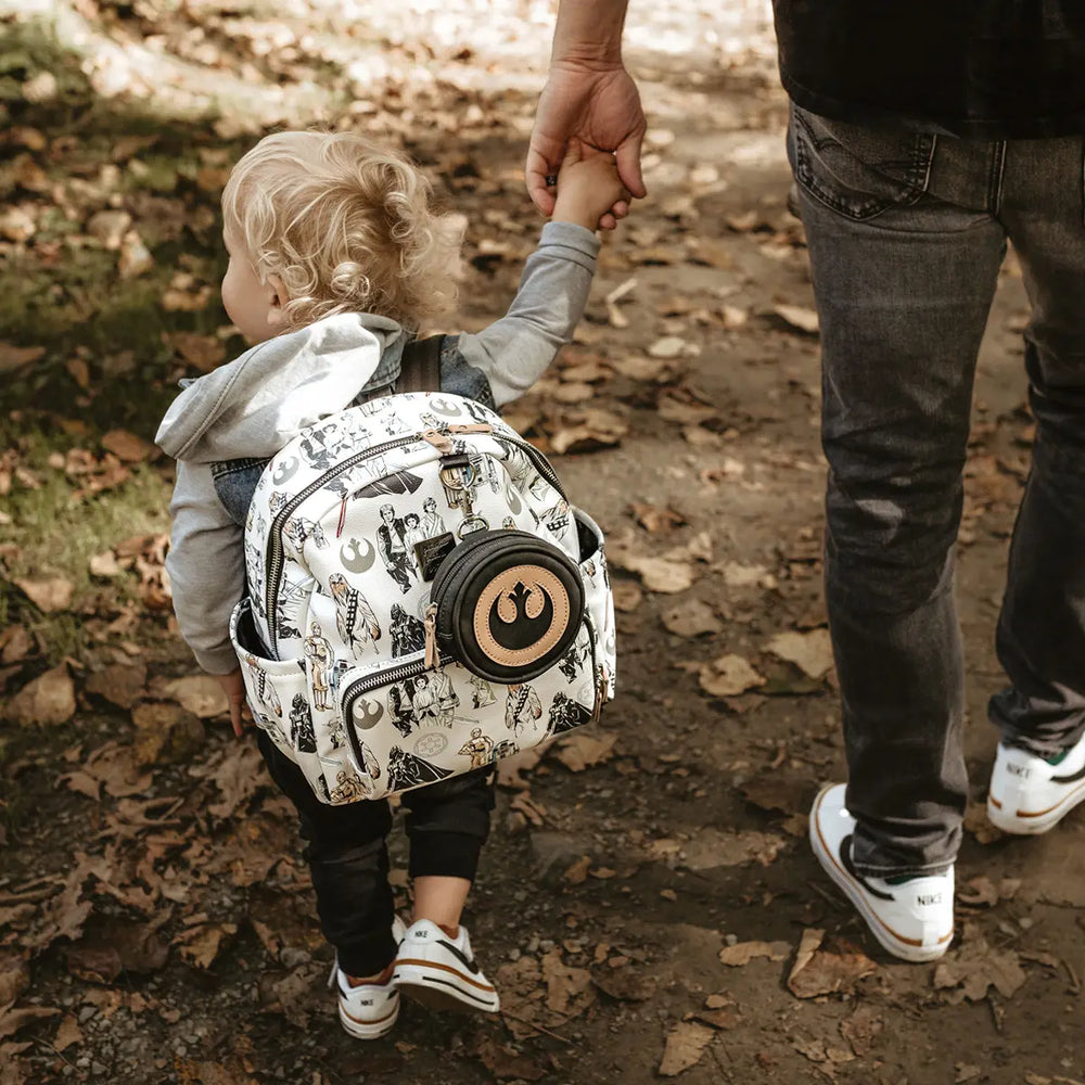 kid wearing the Mini Backpack in The Star Wars Collection while holding hands with dad