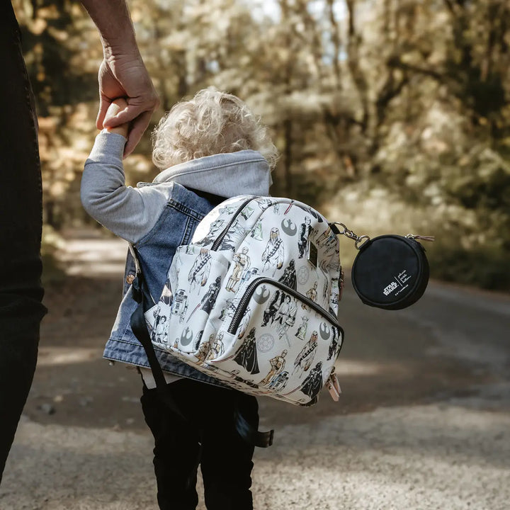 kid wearing the Mini Backpack in The Star Wars Collection while holding hands with dad