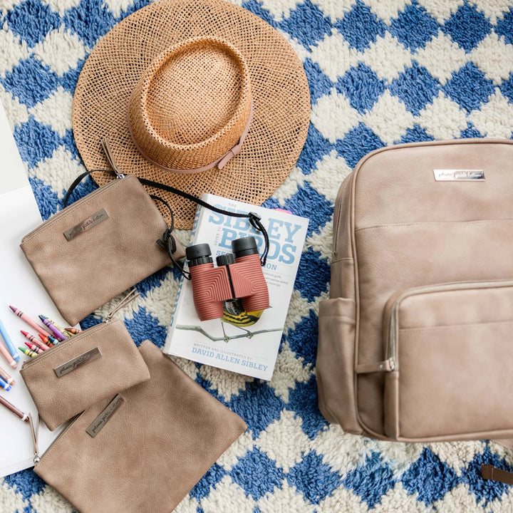 Sync Backpack and organizer trio in Mink laid out with different props