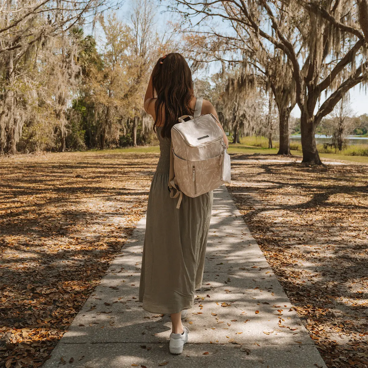 mom walking with the Tempo Backpack in Linen Blossom