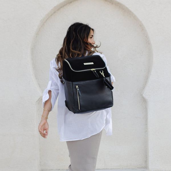 tempo backpack in two tone black faux vegan leather with velvet and pebble texture featuring gold accents