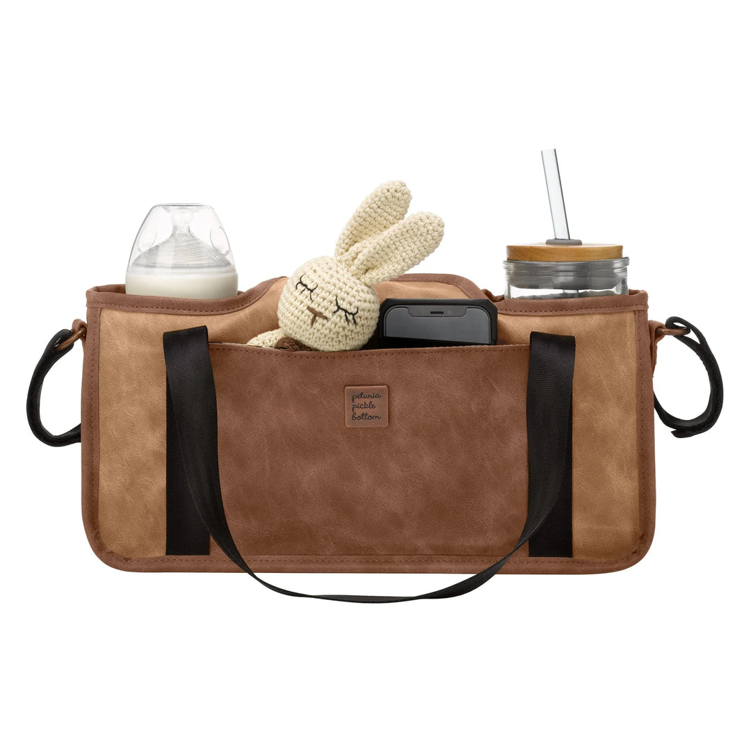 wander stroller caddy in brioche with different items inside