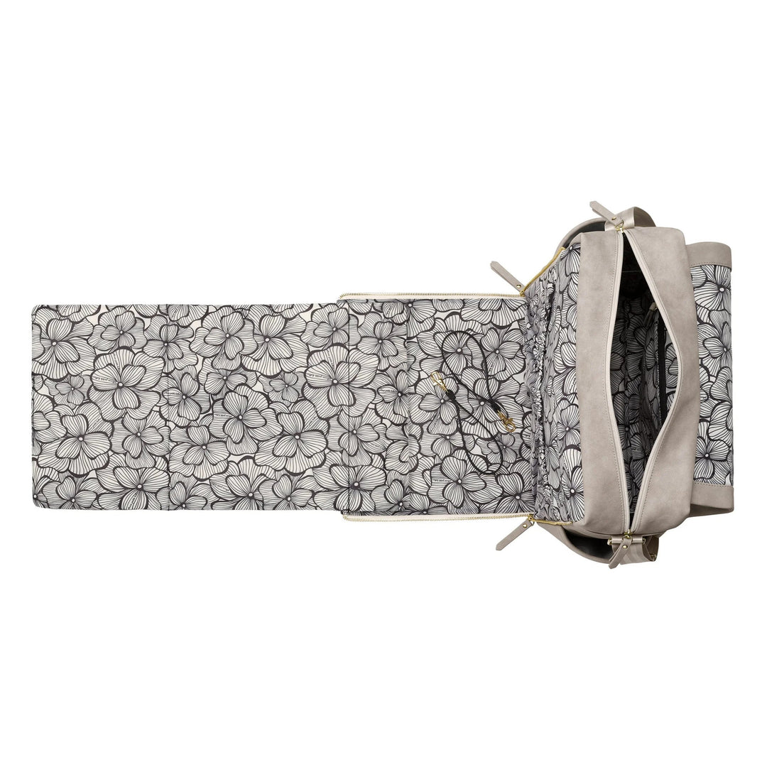 boxy backpack in grey matte leatherette with changing pad open