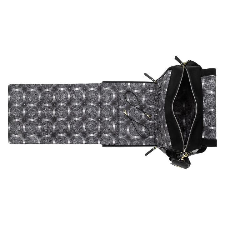 diaper changing pad attached to the boxy backpack in twilight black