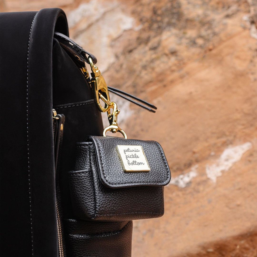 close up image of pocket keychain on boxy backpack in twilight black
