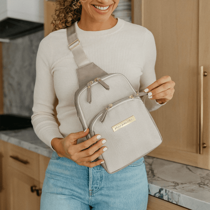 mom wearing the Criss-Cross Sling in Grey Matte Cable Stitch