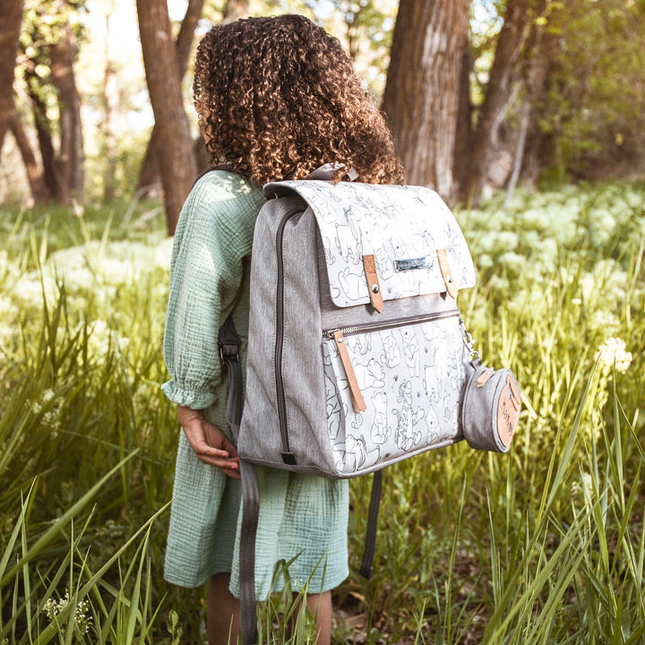 girl wearing the meta backpack in playful pooh