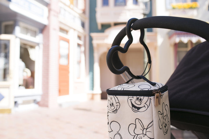 black stroller hook in mickey mouse holds the cool pixel on the stroller handle