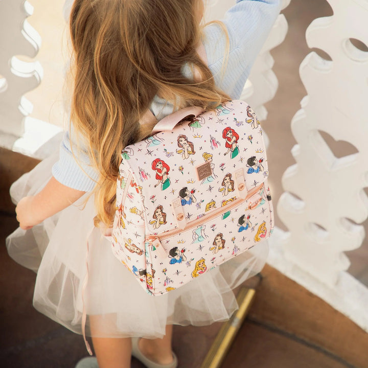 toddler wearing mini meta backpack in disney princess