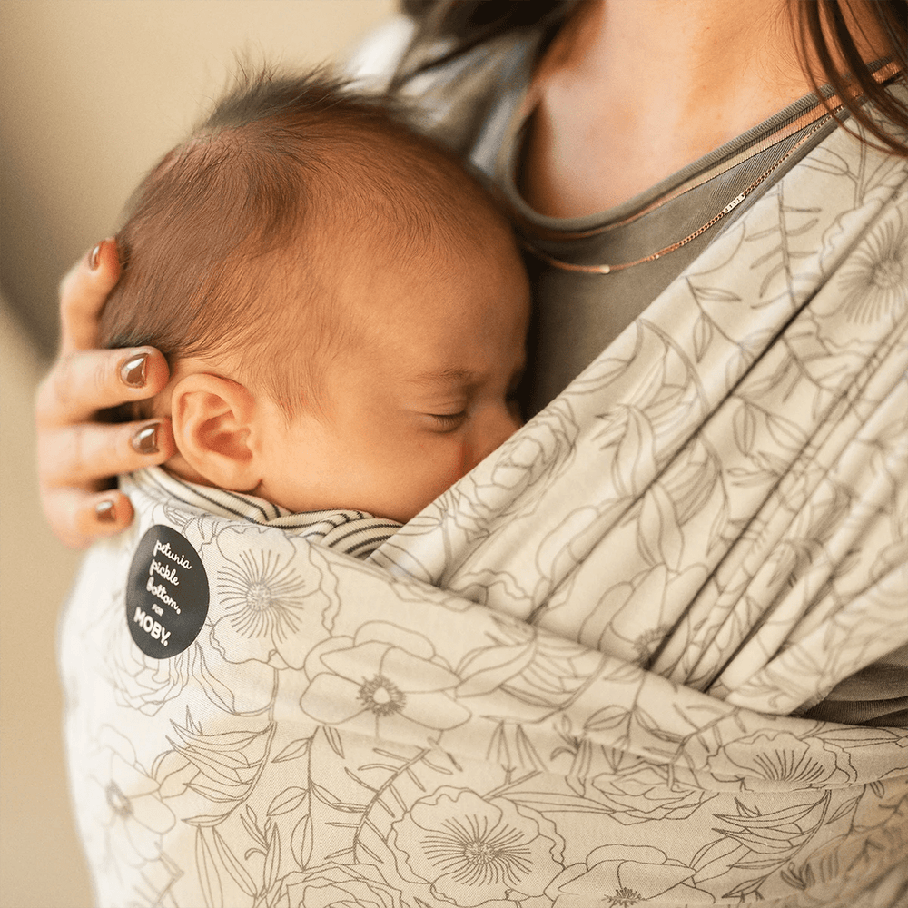mom wearing baby in Petunia Pickle Bottom x MOBY Classic Wrap in Seaside Poppies