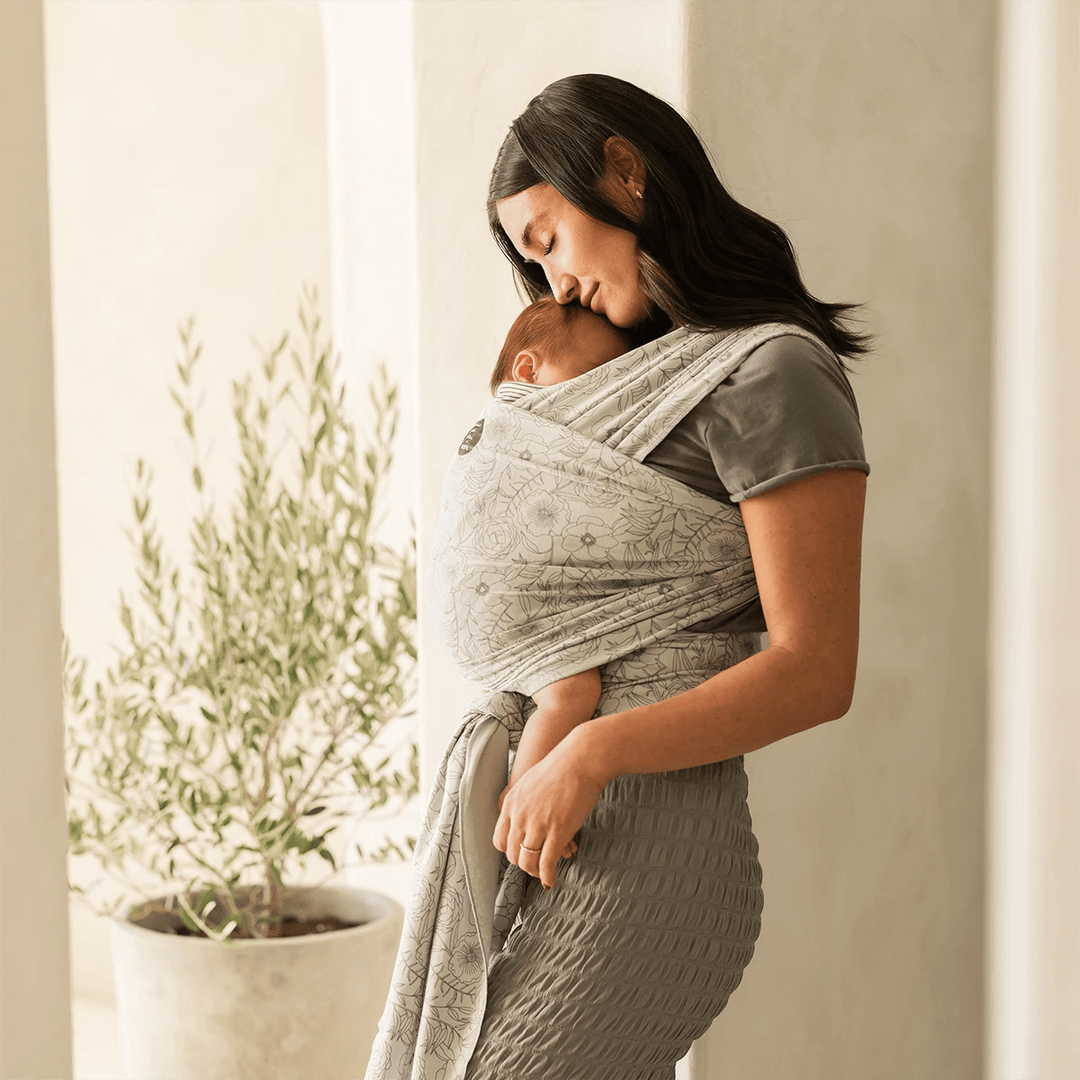 mom wearing baby in Petunia Pickle Bottom x MOBY Classic Wrap in Seaside Poppies