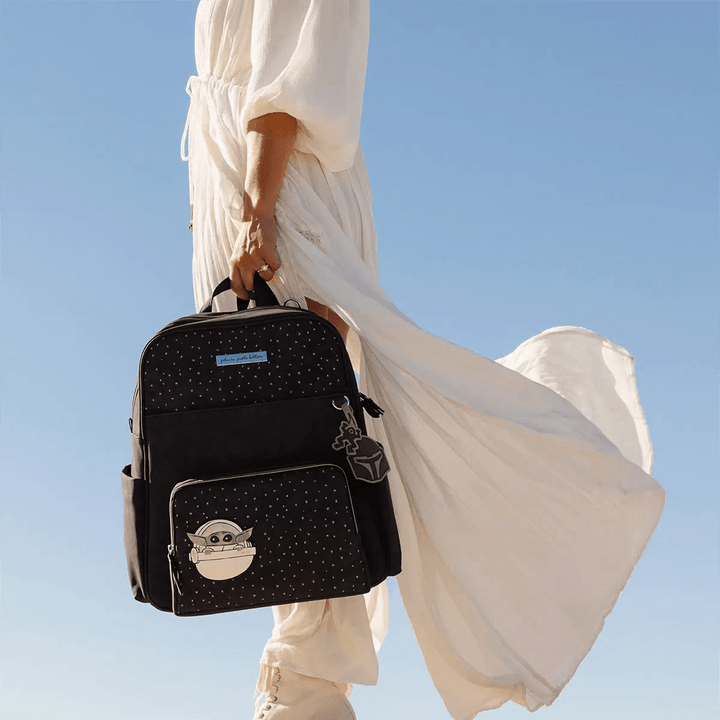 mom holding the Sync Backpack in The Child