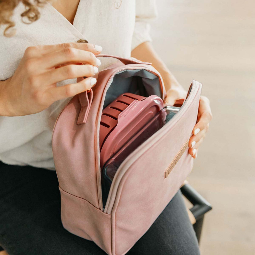 mom holding the Tandem Bottle & Lunch Tote in Toffee Rose