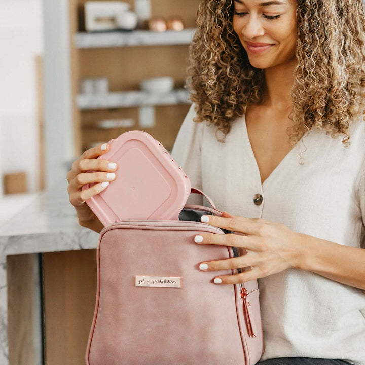 mom holding the Tandem Bottle & Lunch Tote in Toffee Rose