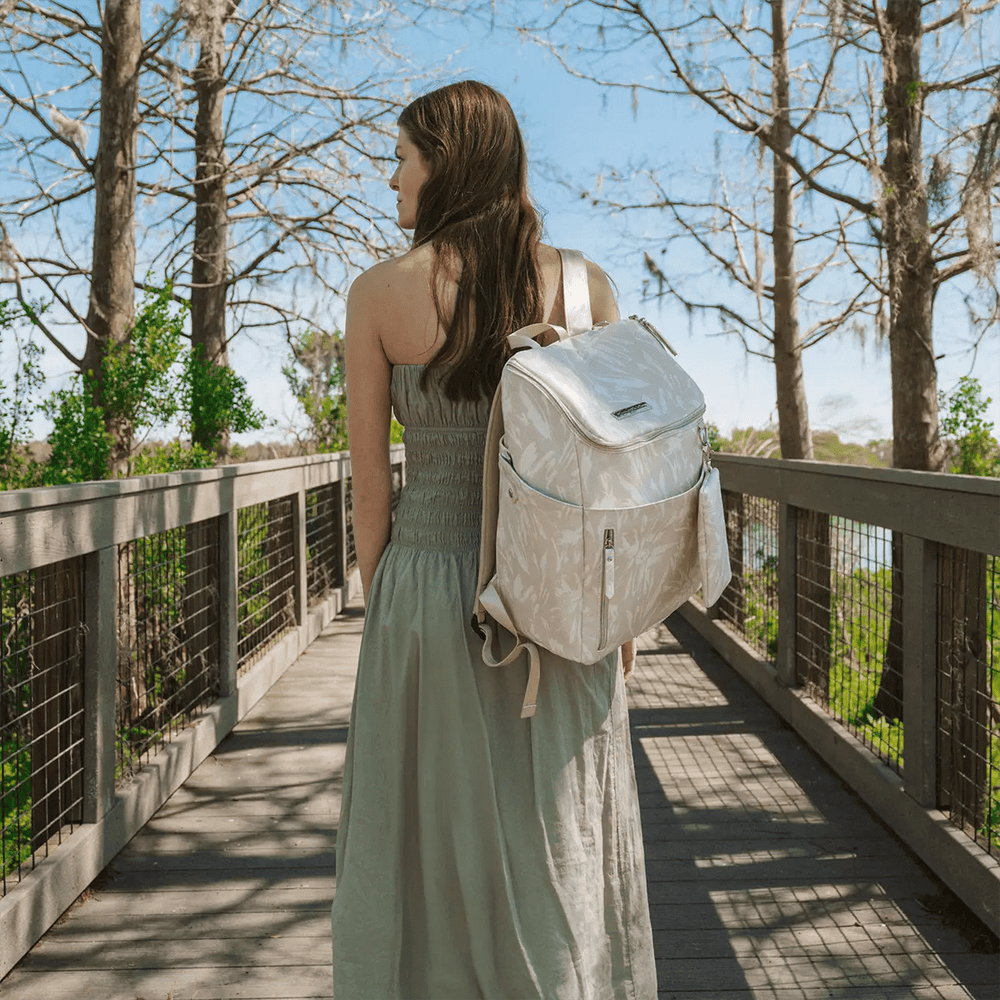 mom carrying the Tempo Backpack in Linen Blossom