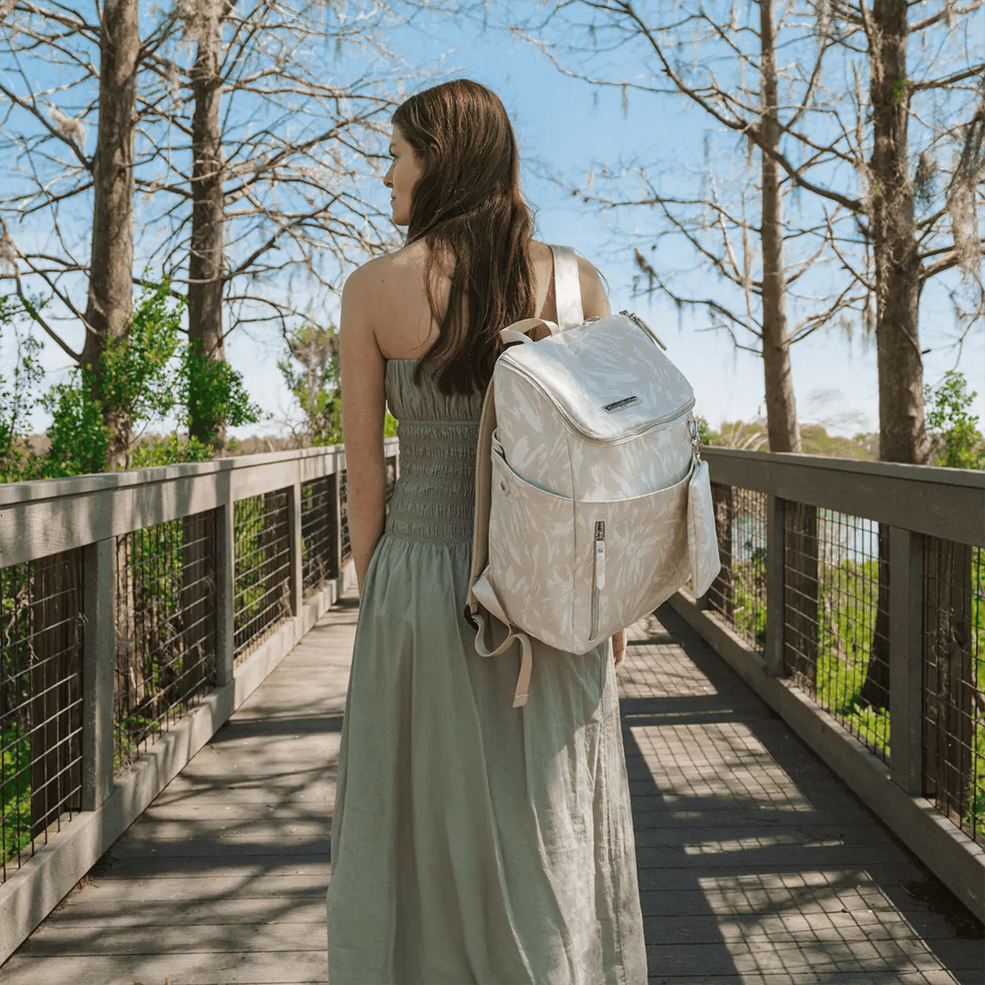 mom carrying the Tempo Backpack in Linen Blossom