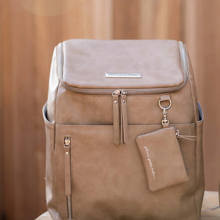 Tempo diaper bag backpack shown in mink. Soft greige color with cool undertones and shiny silver hardware.