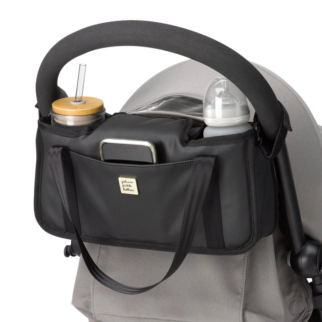 wander stroller caddy in black matte leatherette attached to stroller
